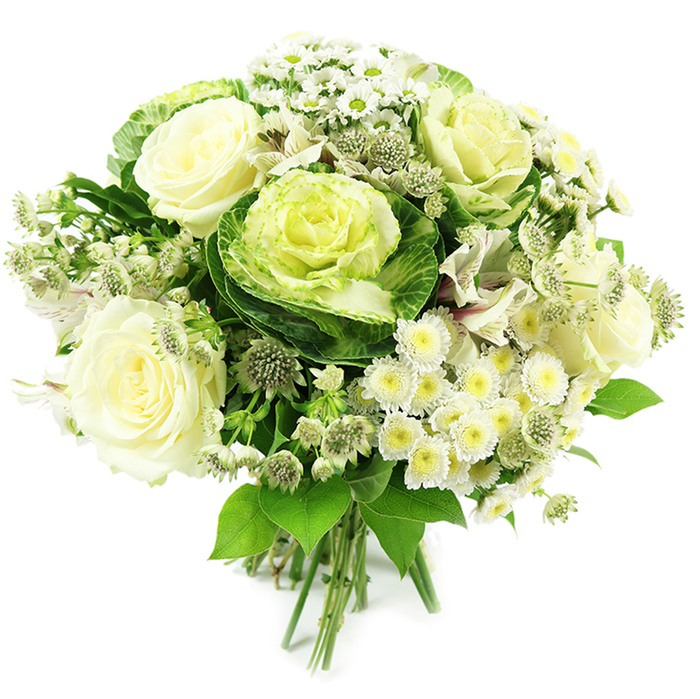 A beautifully arranged hand-tied bouquet in a restrained palette of white, cream and green is shown in crisp detail against a clean white background, so that every texture is easy to imagine. Dominating the centre are several fully open creamy white roses, their petals layered in soft spirals that look almost silky to the touch, embodying that classic, romantic elegance many people in Epping choose for weddings and anniversaries. Nestled alongside them are decorative ornamental kales, their broad outer leaves a rich, earthy green that gradually lightens towards intricately ruffled centres of pale lime and yellow-green, providing a sculptural, garden-inspired focal point. Scattered between the larger blooms are clusters of small white daisies or spray chrysanthemums, each tiny flower with a sunny yellow or yellow-green centre, creating cheerful highlights and breaking up the heavier forms. Finer, starry filler flowers reminiscent of astrantia peek through, contributing an airy, almost wildflower charm that softens the design. Hints of other delicate white petals weave through the bouquet, enhancing its layered look and giving the impression of depth, as if the flowers were gathered from a series of cottage gardens near Epping's quiet residential streets. Surrounding everything is a generous halo of varied green foliage, from deep, glossy leaves to more muted tones, which frames the blooms and adds structure. At the base, the stems are neatly gathered and tied in the traditional hand-tied style, ready to be placed straight into a vase on a kitchen table overlooking Epping Forest. The image conveys purity, serenity and contemporary style, making this bouquet suitable for thoughtful sympathy tributes, elegant celebrations, or simply bringing a touch of refined nature into a modern Epping home.