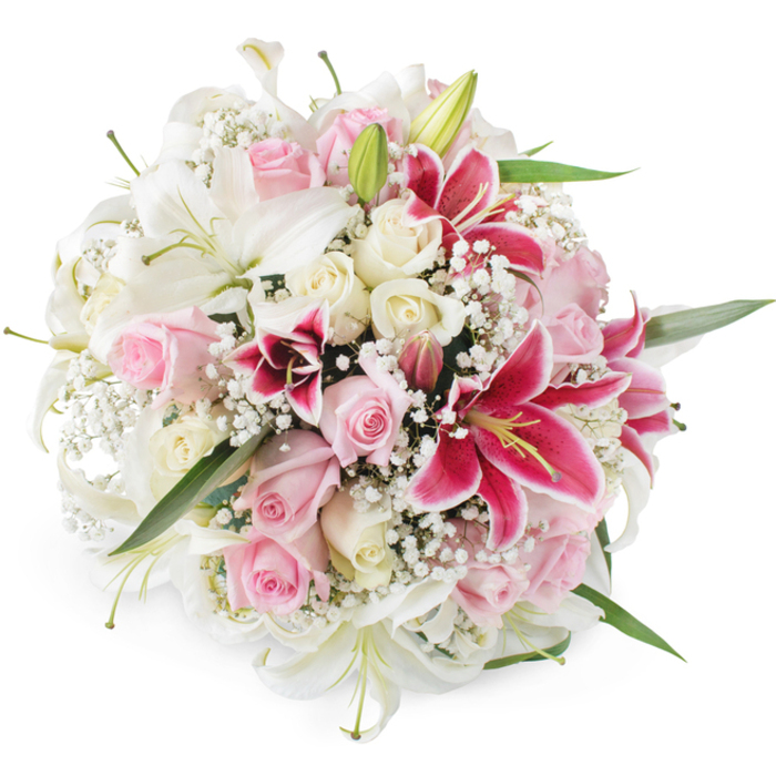 A lush, dome-shaped bouquet fills the frame against a clean, white studio background, its colours and forms highlighted with crisp clarity. Dominating the arrangement are generous white lilies, their trumpet-shaped blooms opening wide, with smooth, satin-like petals that curl gently at the tips, revealing pale green or yellow-tinted stamens. Some lily buds remain closed, their green casings adding a fresh, almost springlike note. Woven between these stately blooms are clusters of soft blush pink roses and creamy white roses, each flower at a different stage of life: tight buds that add structure, half-open blossoms suggesting promise, and fully open roses displaying velvety spirals at their hearts. Bold accents come from several deep pink to magenta Oriental lilies, similar to Stargazers, their star-shaped petals patterned with tiny darker speckles and framing bright golden anthers that lend a sense of drama. Threaded delicately throughout is white baby's breath, its tiny clustered blooms forming a fine, cloud-like veil that softens and unifies the entire composition. Slender strands of green foliage and lily leaves slip between the flowers, introducing natural lines and hints of the hedgerows and green spaces around Epping. The bright, even lighting brings out every nuance of colour and texture, from the smooth gloss of the lily petals to the airy texture of the gypsophila. The bouquet feels opulent yet gentle, ideal for marking weddings held near Epping Forest, anniversaries celebrated at home, or as a luxurious centrepiece for a special family gathering. The arrangement reflects the thoughtful craftsmanship of a skilled local florist, conveying beauty, purity, and heartfelt sentiment in every bloom.