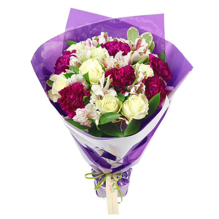 In this image, a beautifully composed bouquet stands out sharply against a pure white background, allowing every flower and texture to be clearly seen, much like a display in a boutique florist just off Epping High Street. The arrangement is built around a classic combination of soft, cream-white roses and deep magenta carnations. The roses show off their elegant, spiral centres and gently curved outer petals, while the carnations offer dense, frilled blooms that bring depth and a rich, velvety tone to the design. Threaded delicately among these larger flowers are white alstroemeria, or Peruvian lilies, with fine, narrow petals adorned with subtle streaks of pink and touches of green, plus small dark markings near the throat that add intrigue and detail. A mix of fresh green foliage surrounds and supports the flowers, some leaves a solid, glossy green, others lightly variegated along the edges, giving the impression of a freshly gathered garden bunch from a local home near Bell Common. The bouquet is skillfully wrapped: an inner layer of smooth, white florist paper forms a clean, structured collar that lifts and frames the blooms, while an outer layer of translucent violet-purple cellophane provides a luminous sheen, catching reflections and adding a celebratory note. The stems are held firmly at the base by a bright lime-green ribbon, tied into a modest yet cheerful bow, from which hangs a small, pale, rectangular gift tag awaiting a handwritten dedication. The entire arrangement feels joyful and refined, suitable for birthdays, anniversaries, or a just-because surprise delivered around Epping, bringing a burst of colour and gentle fragrance into a living room or kitchen.