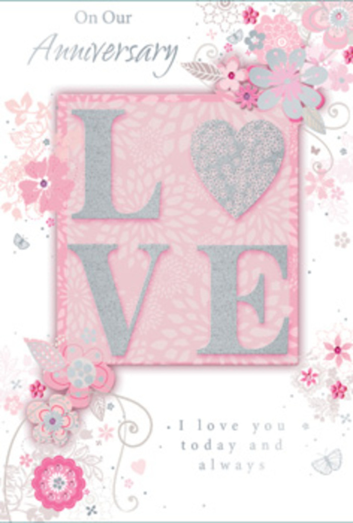 The image shows an open anniversary card resting on a neutral surface, its interior design glowing with warmth, as if someone has just paused in a sunlit room in Epping to reflect on years of shared love. On one panel, the word LOVE appears as the central motif, each letter dusted with frosted glitter that looks almost like crushed pearls, promising a delightful texture under the fingertips. The glittered finish catches the light in subtle flashes, similar to how early sunlight flickers through the trees around the Epping Forest edge. Around this centrepiece drift wispy, hand-drawn blooms and softly trailing sprays of foliage, their petals tinted in gentle pinks, lilacs, and creamy ivory. The blossoms and leaves hover gracefully along the borders, leaving room for light and space, just as a skilled florist allows air between stems to let a bouquet breathe. Fine filigree lines, dainty leaves, and tiny, almost-hidden butterflies weave through the illustration, suggesting the flutter of hearts and the quiet excitement of another anniversary marked together. The message I love you today and always, or similar heartfelt wording, is set in a graceful yet understated typeface that feels personal, like a note written at a kitchen table in a home off Bell Common. The script nestles into the design, neither dominating nor fading, but instead gently echoing the floral curves. The entire composition feels like a hand-tied bouquet translated into paper: pastel flowers, light greenery, and glittering accents instead of water and stems. It has the mood of a keepsake you'd pair with a tender arrangement of roses and seasonal blooms, perhaps ordered for same-day delivery across Epping from a trusted local florist who understands how to capture quiet devotion in both flowers and design.