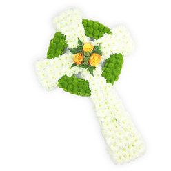 A carefully modelled three-dimensional Celtic cross crafted from fresh blossoms, photographed from slightly above against a clean white surface so every shape and texture reads clearly. The cross's main mass is formed from dense clusters of pristine white spray chrysanthemums whose compact petals create a plush, serene backdrop across the arms and long shaft. Interlaced with that white field are bright apple-green button chrysanthemums; their small, spherical blooms are used to outline the circular ring where the cross's arms intersect and to fill alternating sections of the arms, producing a striking contrast of colour and tactile rhythm reminiscent of woven Celtic patterns. Anchoring the composition at the heart, a trio of open, warm orange-yellow roses provides a poignant, luminous focal point - their velvety petals framed by sprigs of dark green foliage that pick out the roses and add a subtle evergreen accent. The soft, natural lighting highlights petal edges and shadowed depth, lending the cross three-dimensional presence appropriate for a funeral or memorial. From our Epping workshop I often prepare pieces like this for services held near the High Street crematorium route or at local churches by the forest edge; the palette quietly evokes Irish lineage without overstating it. Offered with the attentive handling of Flowers Epping, this arrangement communicates sympathy, remembrance and a calm dignity - a floral testament balanced between purity, renewal and heartfelt tribute.