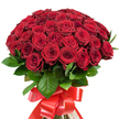 Over fifty lush, crimson red roses are woven together by an Epping florist into a sumptuous bouquet that radiates romance and sophistication. The full, domed shape boasts velvety petals ranging from tightly wrapped buds to gracefully blooming flowers, the layered structure teasing out hidden depths and whispered stories of devotion. Glossy, deep green foliage peeks between the flowers, adding both vibrancy and a touch of the English countryside found at the edge of Epping Forest. Tying it all together is a rich satin ribbon, luxuriantly wide and dyed to match the roses, arranged into a dramatic, multi-looped bow with elegant trailing ends-an emblem of celebration in itself. Set against a bright white background, every rich hue and subtle gleam stands out-the arrangement practically pulses with the promise of heartfelt emotion, suitable for any occasion from a grand anniversary to a spontaneous gesture on Kendal Avenue. Florists in Epping pour skill and artistry into every bouquet, ensuring each stem and petal is perfectly chosen and positioned; the result is a present as memorable as the moment it marks, ready for prompt delivery throughout the community and beyond.