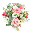 A delicate, dome-shaped hatbox arrangement rests against a pure white background, the shot taken from slightly above so the viewer can appreciate the full composition. The container is a round, soft blush pink box, smooth and understated, encircled by a fine reddish-pink satin ribbon with a cream tag attached, suggesting a boutique florist's touch familiar to many in the Epping area. Emerging from the hatbox is a lush mix of seasonal flowers in pink, white, and green tones. Large, light pink roses take centre stage, their velvety petals swirling in gentle spirals, some fully open, others half-unfurled, lending a romantic and serene mood reminiscent of a quiet afternoon in Epping Forest. Around them, white daisy-like chrysanthemums with bright green centres add a lively, joyful feel, their simple shapes contrasting beautifully with the complexity of the roses. White alstroemeria, lightly streaked and speckled with purplish-red markings, weave among the blooms, bringing an intricate, almost whisper-soft detail that rewards a closer look. The greenery is thoughtfully layered: rounded eucalyptus leaves in a silvery-green shade provide a cool, fragrant cushion, while longer, darker green foliage slips between the stems, adding depth and a hint of movement. Small touches of reddish-brown buds or berry-like accents peek through, enhancing the natural, garden-fresh character of the piece. Overall, the palette of blush pink, crisp white, and varied greens feels harmonious and calm, making this floral hatbox perfect for a birthday surprise, a sweet romantic gesture, or a gentle just because gift. It's easy to imagine it being hand-delivered by a local Epping florist, ready to grace a bedside table or dining room with soft colour and quiet beauty.